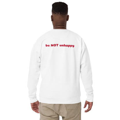 Person wearing a white long-sleeve shirt with 'be NOT unhappy' text on the back, standing against a white background.