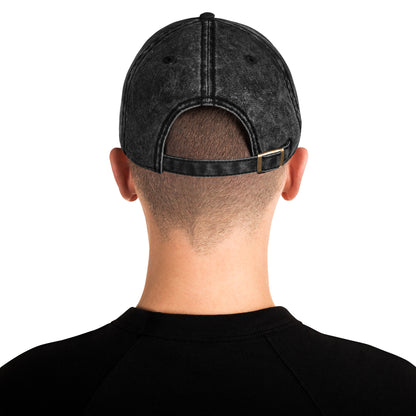 Person wearing a black denim cap from behind on a white background
