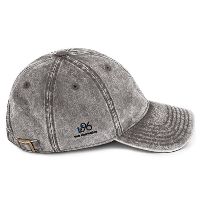 Gray distressed baseball cap with a logo on a white background