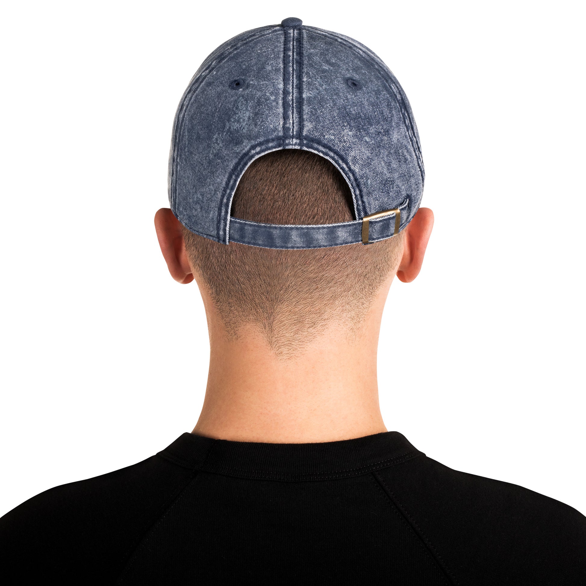 Person wearing a gray denim cap from behind on a white background