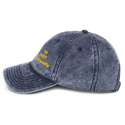 Blue distressed baseball cap with yellow text on a white background