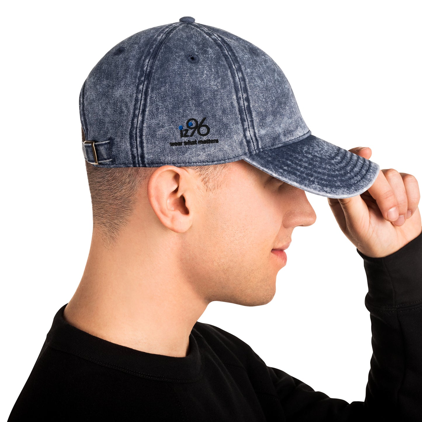 Person wearing a denim cap with a logo on a white background