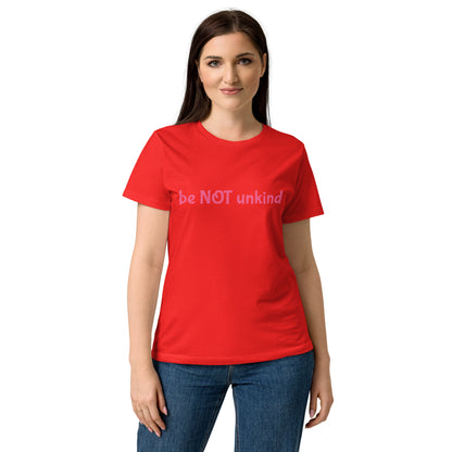 Woman wearing a cherry red t-shirt with colorful graphic and white background