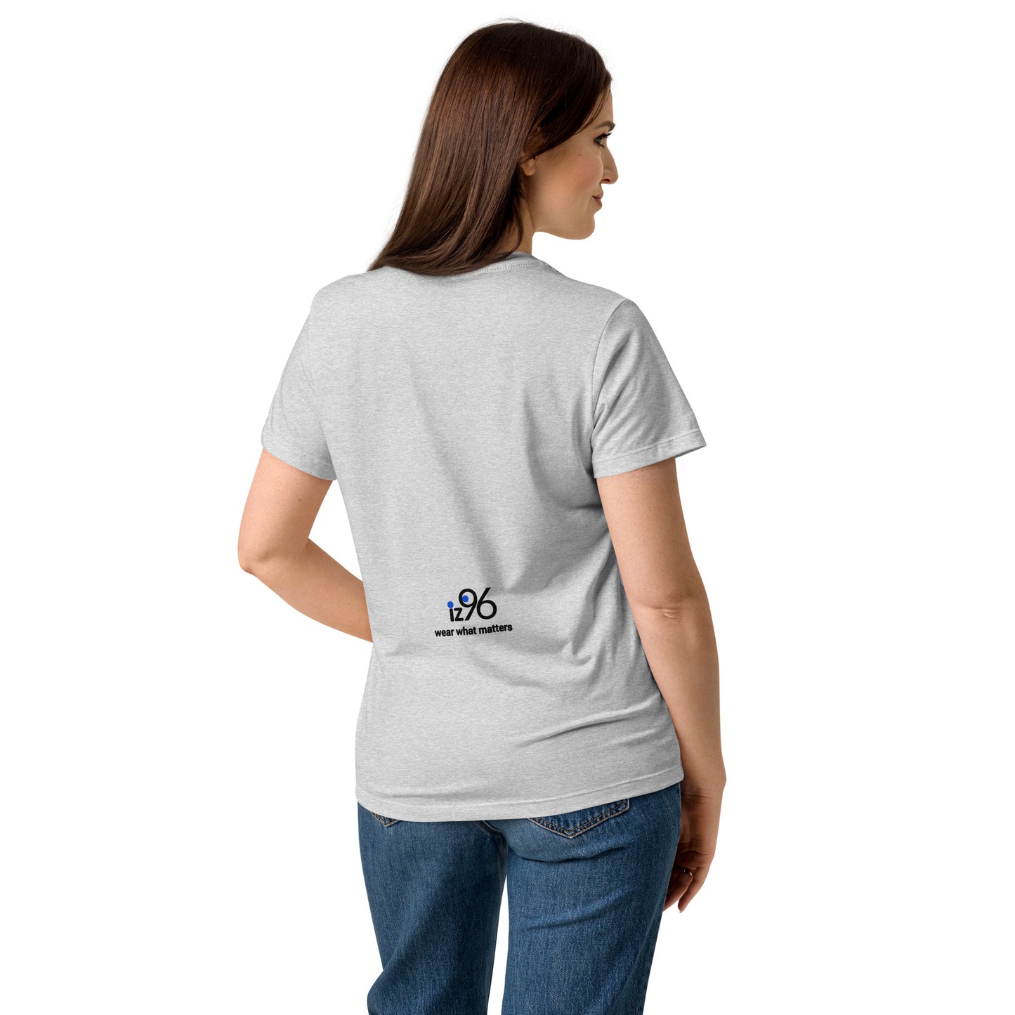 Woman wearing a gray t-shirt with a logo on the back, standing against a white background