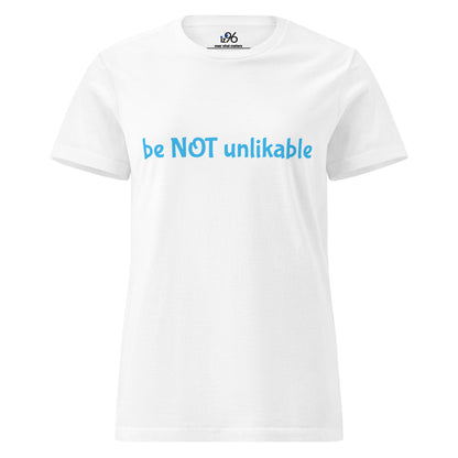 White t-shirt with blue text 'be NOT unlikable' on a white background