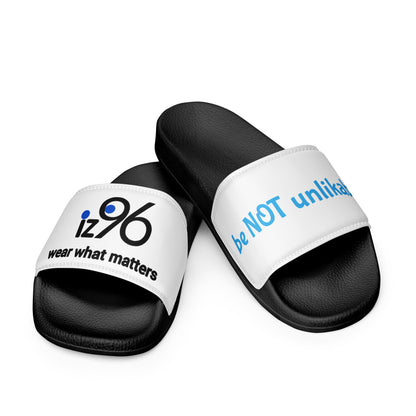 Black slides with white straps featuring text on a white background