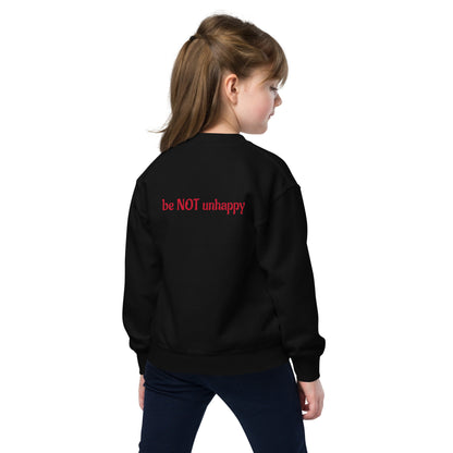 Child wearing a black sweatshirt on a white background
