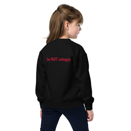 Child wearing a black sweatshirt on a white background