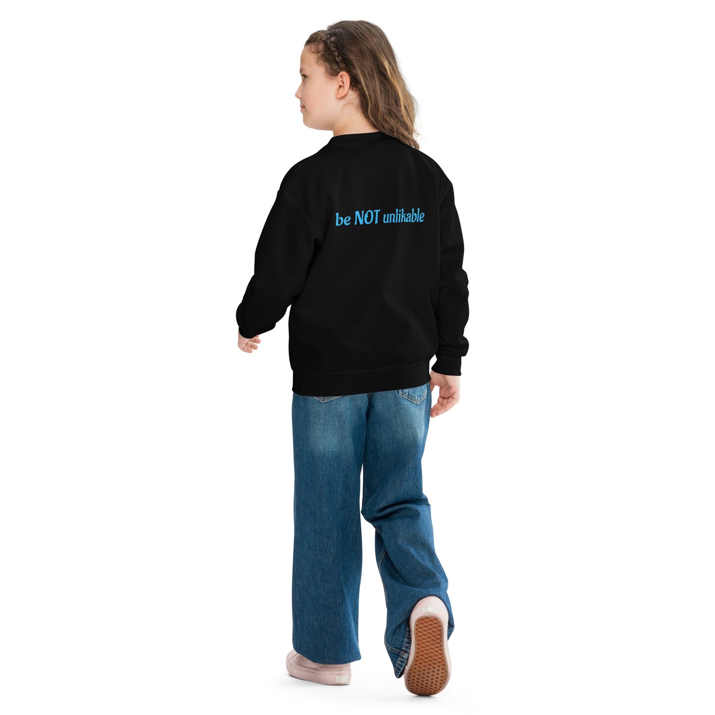 Person wearing a black sweatshirt with text on the back, standing against a white background