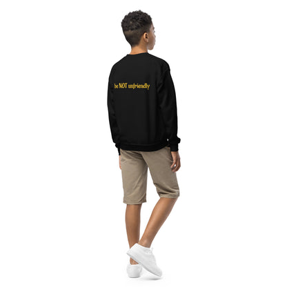Person wearing a black sweatshirt with yellow text on the back, standing against a white background