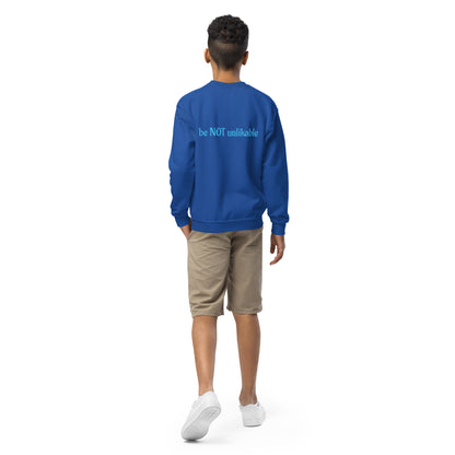 Person wearing a blue sweatshirt with a text on the back, standing against a white background
