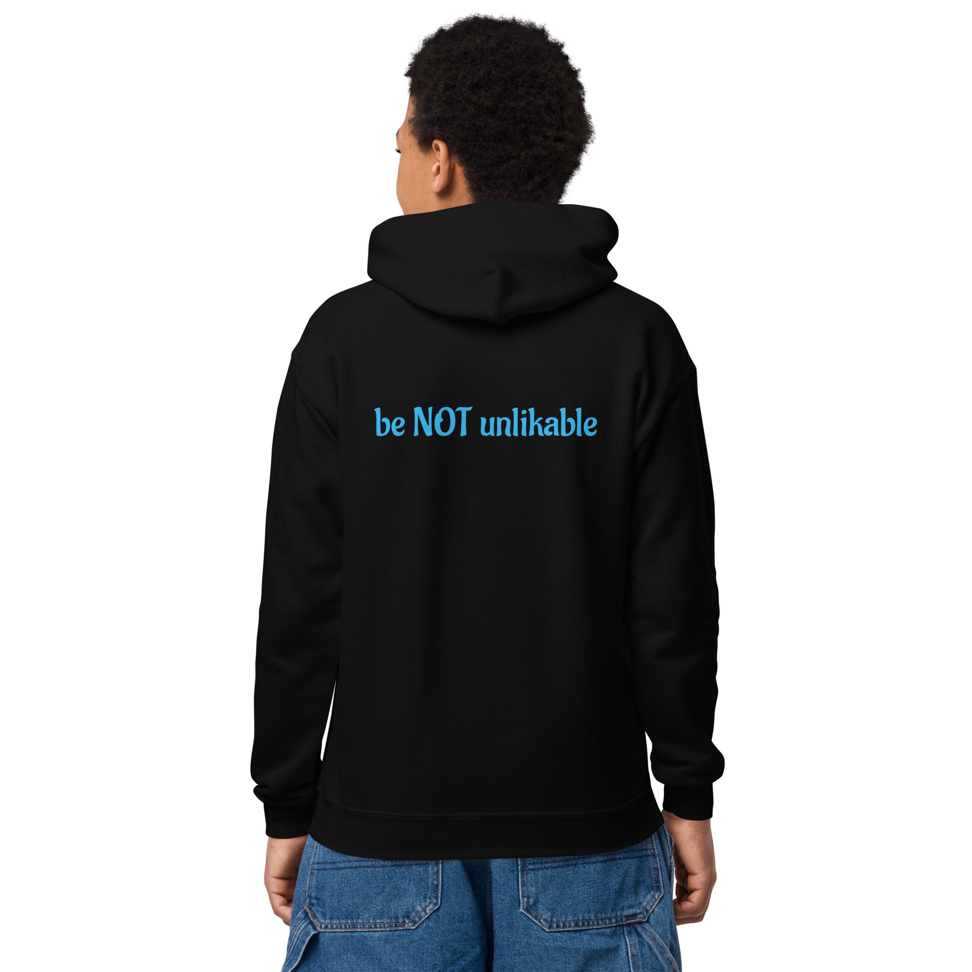 Person wearing a black hoodie with 'be NOT unlikable' text on the back, standing against a white background.