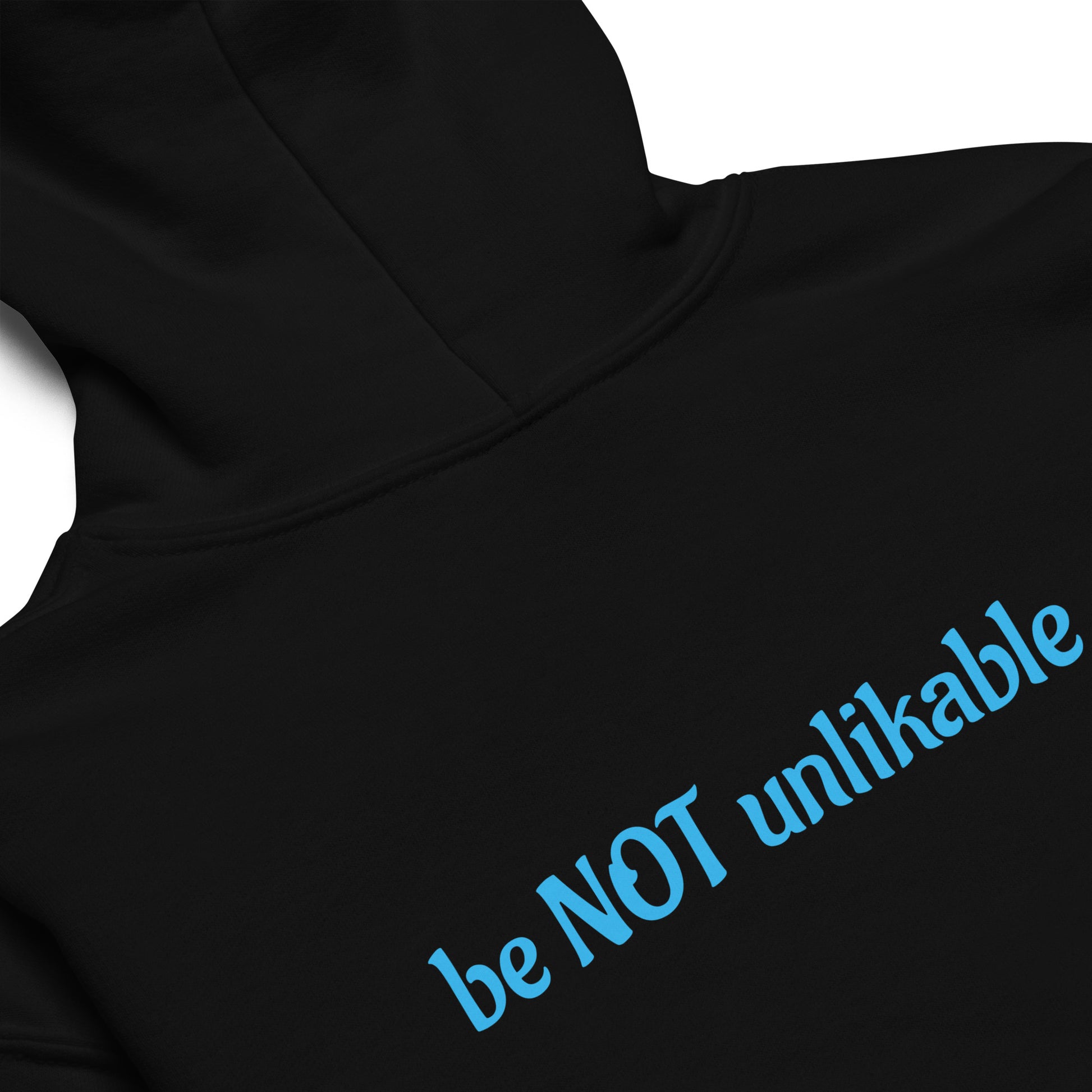 Black hoodie with blue text 'be NOT unlikable' on a white background