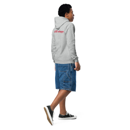 Person wearing a gray hoodie and blue shorts on a white background
