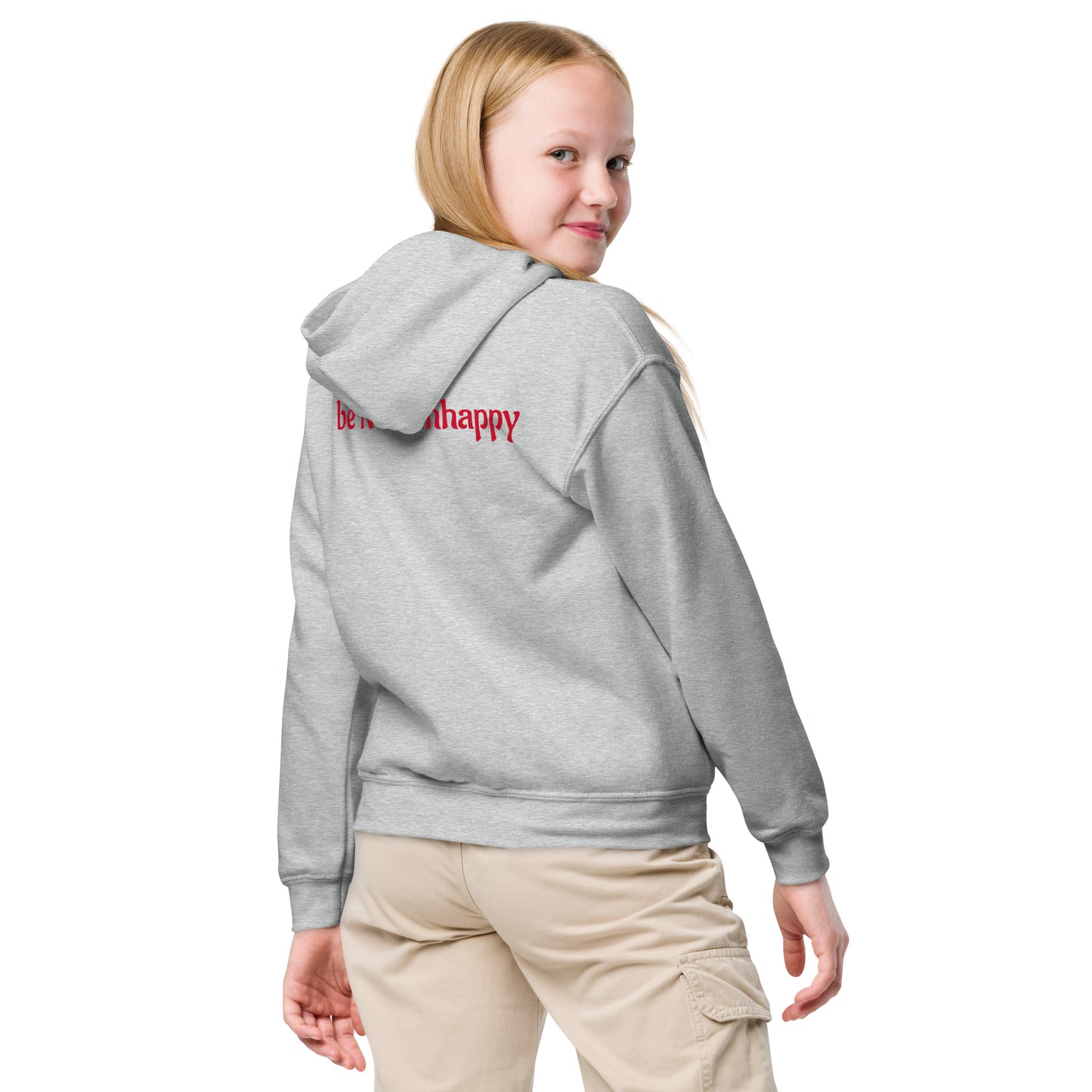 Girl wearing a gray hoodie with text on the back against a white background