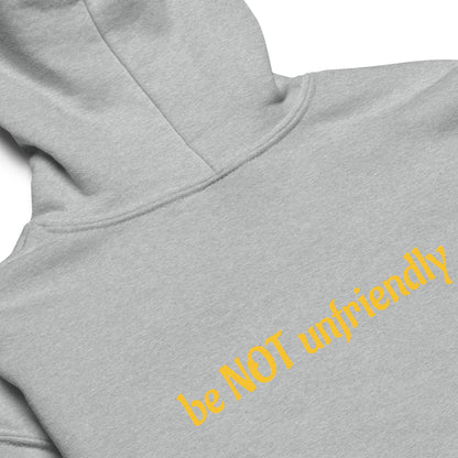 Gray hoodie with yellow text 'be NOT unfriendly' on a white background