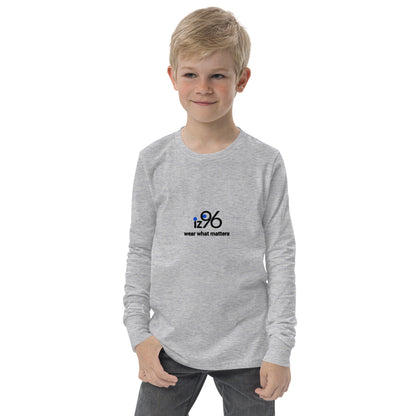 Child wearing a gray long-sleeve shirt with a logo on a white background