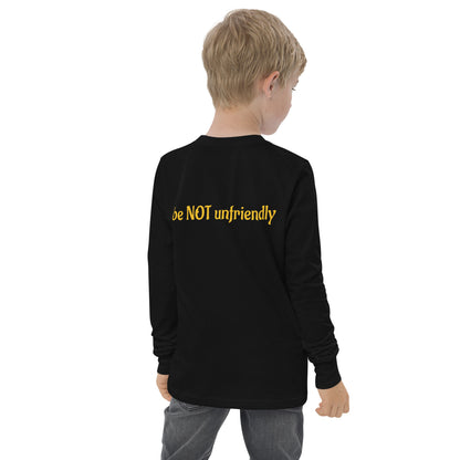 Child wearing a black long-sleeve shirt with 'be NOT unfriendly' text on the back, standing against a white background.