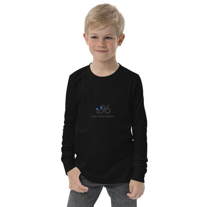 Child wearing a black long-sleeve shirt with 'iz96 wear what matters' logo on a white background