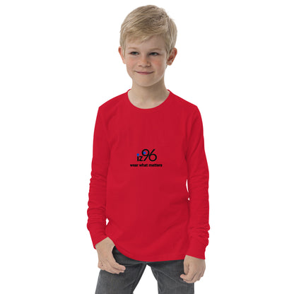 Child wearing a red long-sleeve shirt with a black logo on a white background