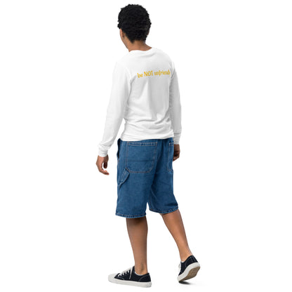 Person wearing a white long-sleeve shirt with text and blue shorts on a white background
