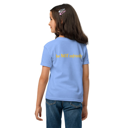 Child wearing a light blue t-shirt and jeans on a white background