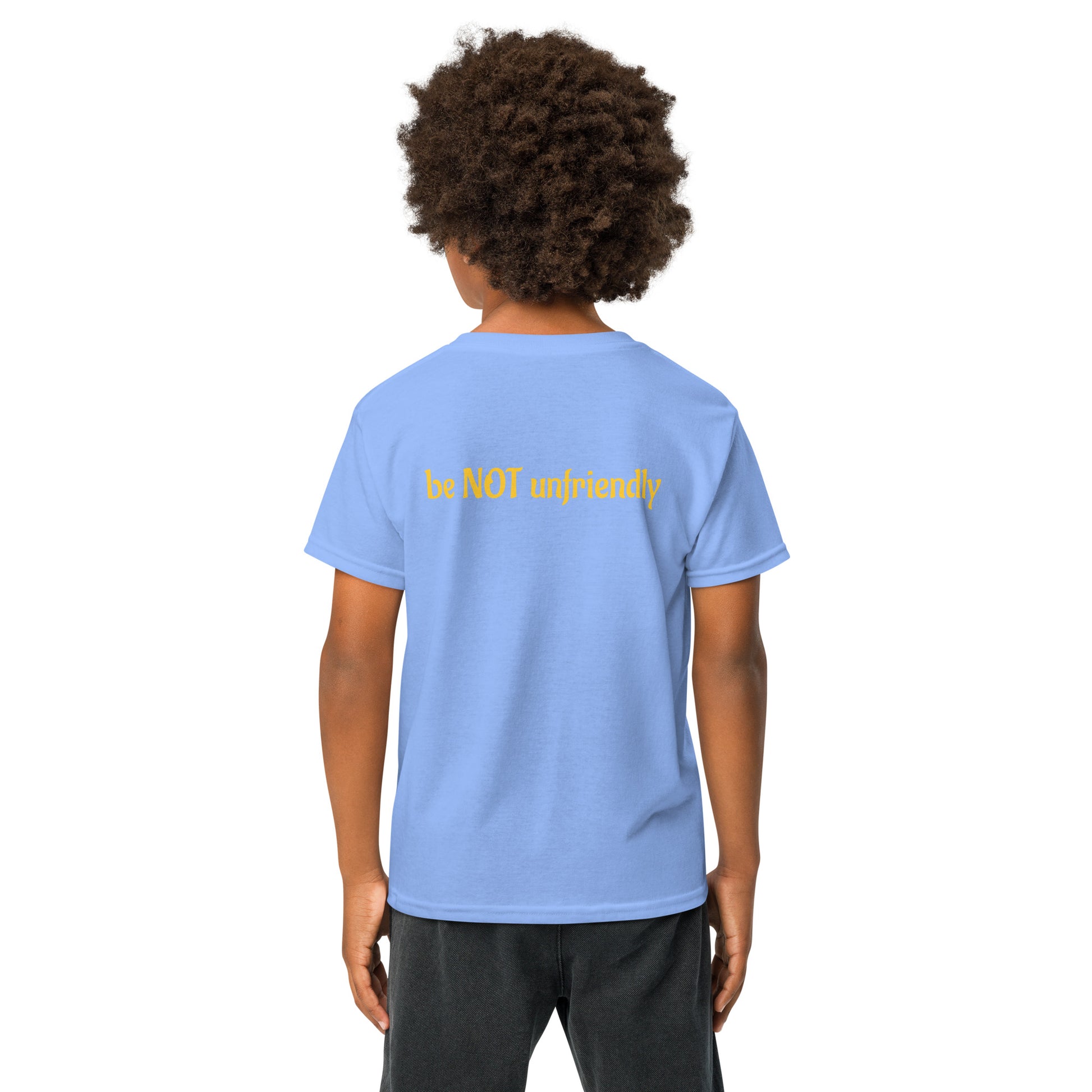 Boy wearing a light blue t-shirt with a logo on the back, standing against a white background