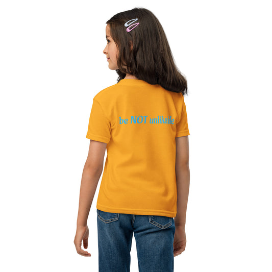 Girl wearing tshirt with 'be not unlikable' text on a white background