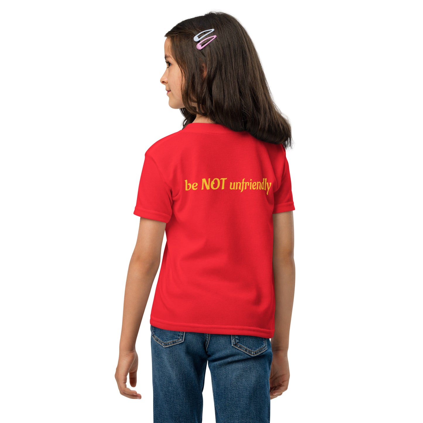 Child wearing a red shirt and blue jeans on a white background